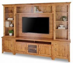 California Made Solid Knotty Alder Wood Oregon High Performance Television Wall Unit features a flat-screen TV, open shelves for books and plants, closed storage cabinets below, and a natural wood finish.